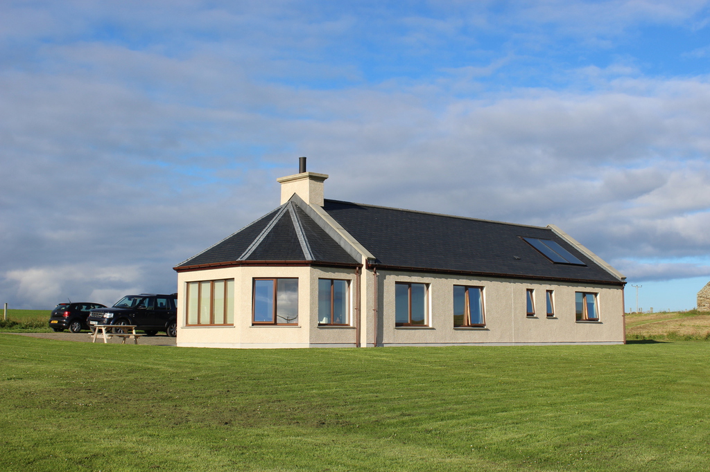 Millhill Cottage under a big Orkney sky